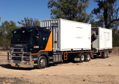 trucks with two connected white trailer boxes